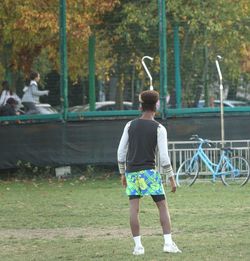 Full length rear view of man standing at park