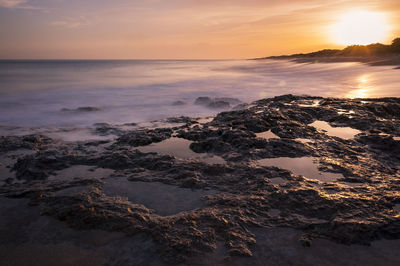Scenic view of sea against sky during sunset