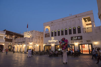 Group of people in front of building