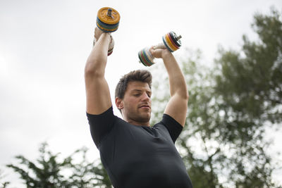 Low angle view of man exercising outdoors