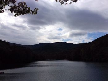 Scenic view of mountains against cloudy sky