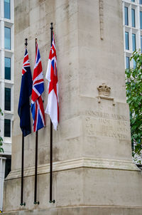 Low angle view of flag against building