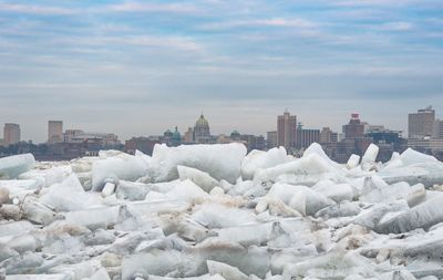 View of cityscape against sky during winter