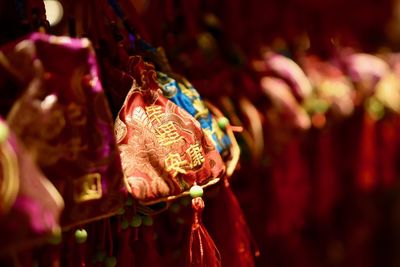 Close-up of decorations hanging for sale in market