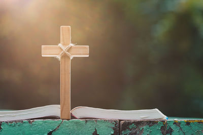 Close-up of cross on window