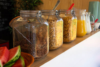 Close-up of fruits in glass jar on table