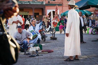 People on street market in city