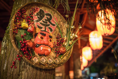 Low angle view of illuminated lanterns hanging at night