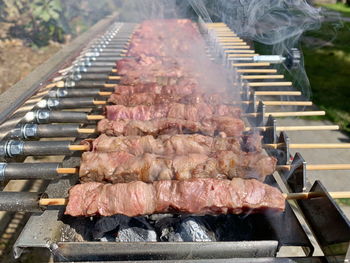 High angle view of meat on barbecue grill