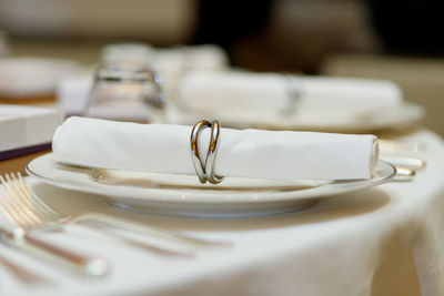 Place setting on table in restaurant