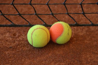 High angle view of tennis balls on field