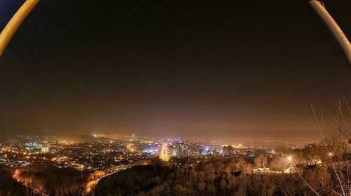 Aerial view of illuminated cityscape at night