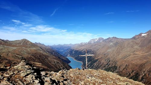 Scenic view of mountains against blue sky