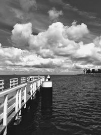 Pier over sea against sky