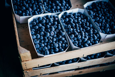 High angle view of fruits in crate at market stall