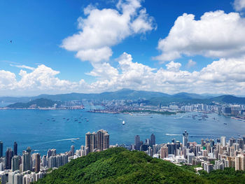 Panoramic shot of city by sea against sky