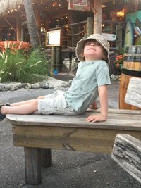 Portrait of a young man sitting on bench