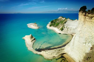 Scenic view of sea against blue sky