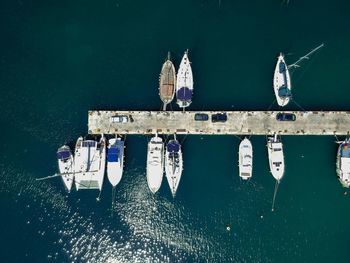 Aerial view of sailboats moored at sea