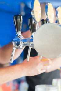 Close-up of hands working at bar