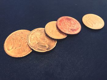 High angle view of coins on table