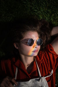 Portrait of young woman wearing sunglasses