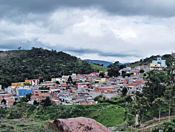 High angle view of town against cloudy sky