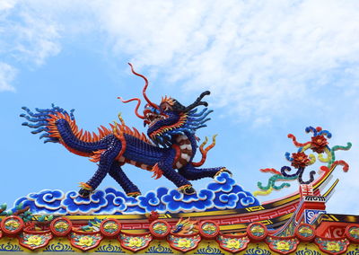 Low angle view of statue against sky