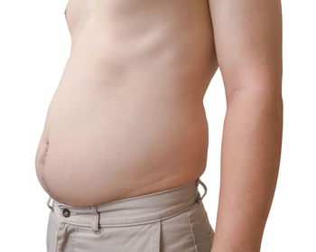 Rear view of woman standing against white background