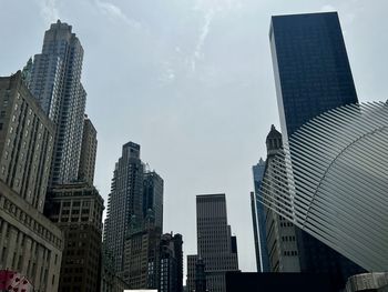 Low angle view of skyscrapers against sky