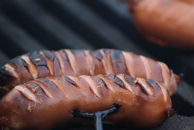 Close-up of hot dog on barbecue grill