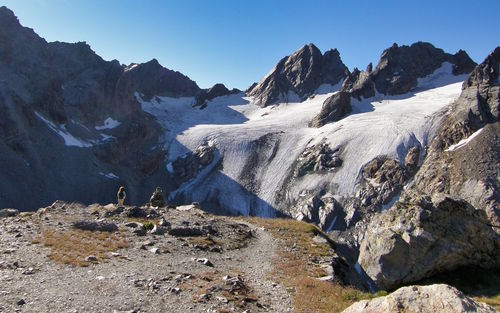 Scenic view of snowcapped mountains against clear sky