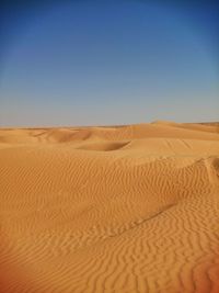 Scenic view of desert against clear sky