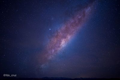 Low angle view of stars in sky at night