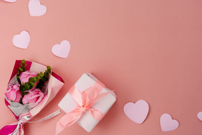 Close-up of pink roses on table