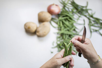 Close-up of person hand holding vegetables