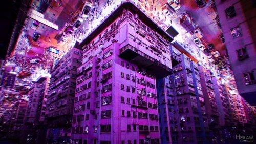 Low angle view of illuminated buildings at night