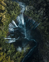 Drone view of water flowing through mountains