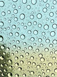 Full frame shot of wet glass window