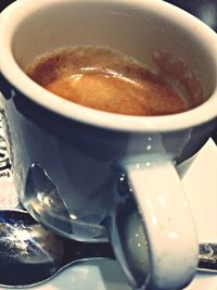 Close-up of coffee cup on table