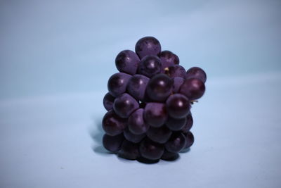 Close-up of grapes against white background