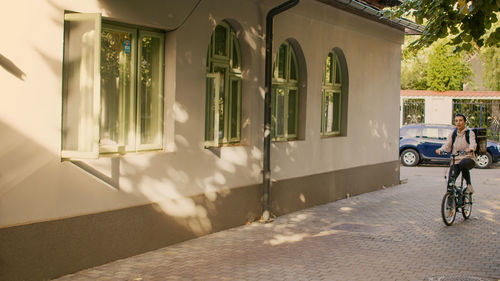 Rear view of man walking on street