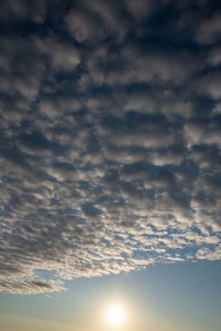 Low angle view of cloudy sky during sunset