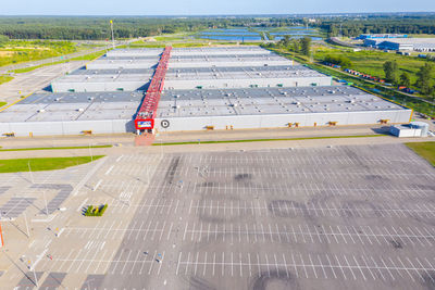 Huge shopping mall of household goods with a lot of parking space, aerial view