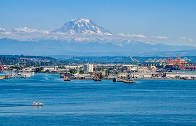 Mount rainier towers over the port of tacoma.