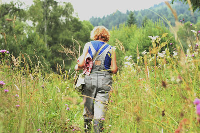 Rear view of man standing on field