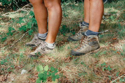 Low section of people standing on land