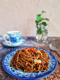 Close-up of noodles served in plate