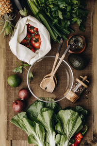 Directly above shot of vegetables by bowl on table