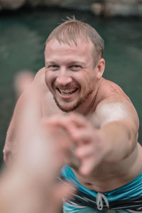 Portrait of young man in water